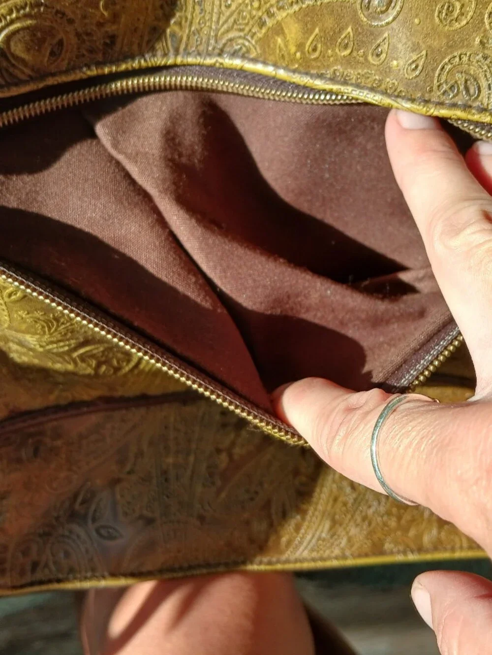 Relic Embossed Leather Crossbody Bag in Gold